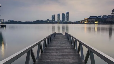 Sun rising at Pullman jetty, Putrajaya. Zoom out Timelapse Motion Stock Footage 83016774
