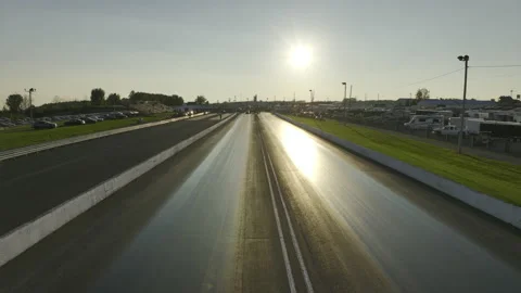 Sun rising reflected on race track Stock Footage 231348298