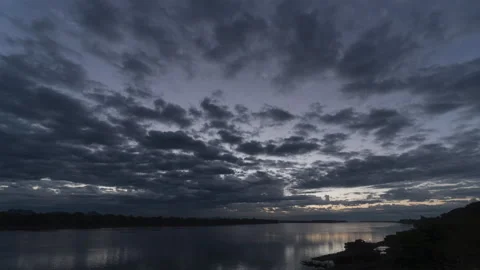 The sun rising though amazing clouds Stock Footage 168275592