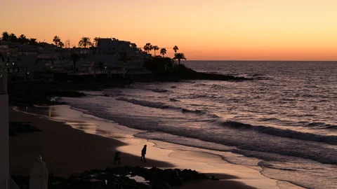 Sun rising on a vacation beach Stock Footage 168335326