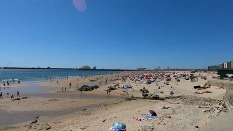 Sun, Sand, and Crowds A Busy Day at the Beach Stock Footage 277270896