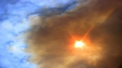 Sun Seen Through Smoke Cloud Stock Photos
