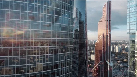 A sun set drone Aerial shot of skyscrapers of  business centre Video stock 84066003
