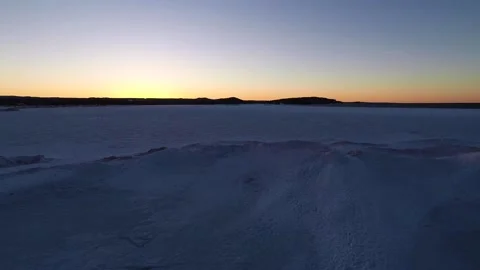 A sun set on Lake Superior in the winter in Northern Michigan Stock Footage 137342844