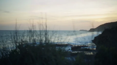 Sun set ocean shore. Waves crashing against the shore. Stock Footage 108484271