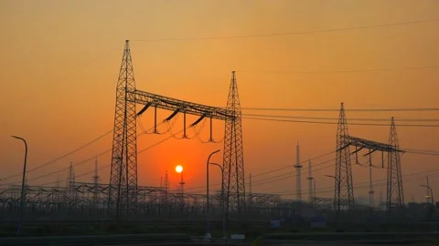 Sun set power station and grid in plant india Stock Footage 211377406