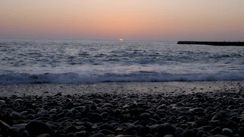 Sun set in sea. Sun hide to horizont in sea. One minute sunset process Stock Footage 105207992