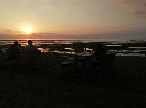 Sun set time on the beach front restaurant Stock Photos