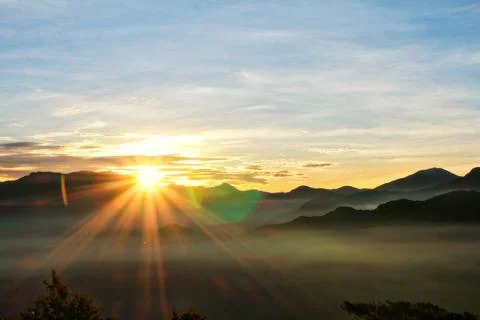 Sun set view over mountains with fog on floor ground in the morning. Alishan  Stock Photos