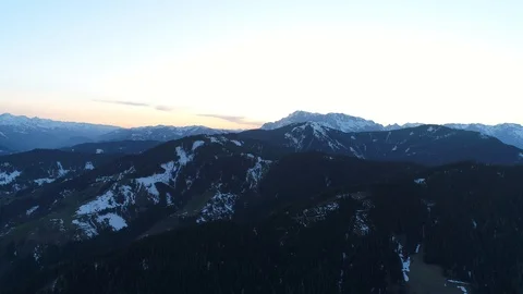 Sun set view of snowy peaks of austrian Alps easily covered with snow. Panoramic Stock Footage 124533374
