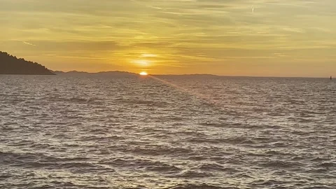 SUN SETING OVER SEA HORIZON Stock Footage 202172401
