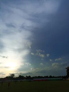 The sun sets in the afternoon when there are many people in the field Stock Photos