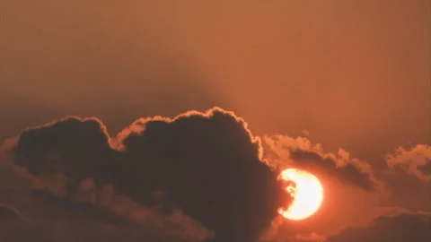 The sun sets and is covered by clouds Stock Footage 283863019