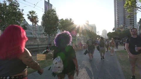 Sun sets, attendees leave convention center Stock Footage 246636115