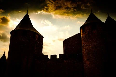 The sun sets behind the Chateau Comtal in the Cité de Carcassonne, France Stock Photos