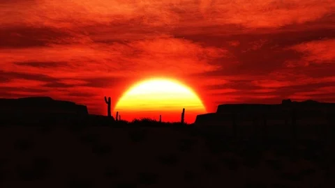 The sun sets behind a mesa in the desert Video stock 72195043