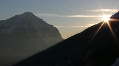 Sun sets behind mountain Video stock 21652743