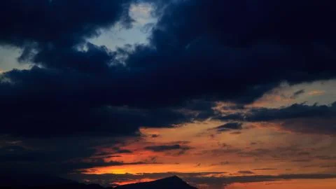 The sun sets behind the mountains. beautiful panorama and view of the setting Stock Photos