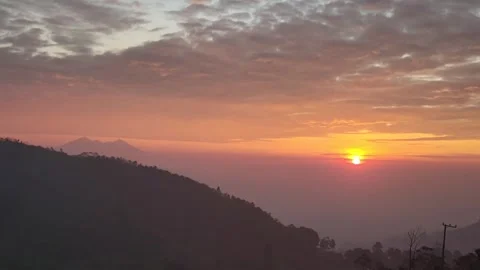 The sun sets behind the mountains, Watching over the stunning mountain landscape Stock Footage 284751361