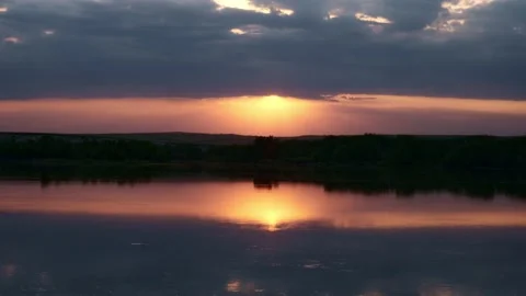 The sun sets behind the river and the forest Stock Footage 196822137