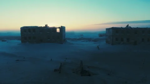 The sun sets behind the ruined house Stock Footage 126829639