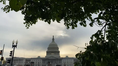 The sun sets behind the US Capitol Stock Footage 128836314