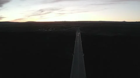 The sun sets behind a vast landscape and desert bridge near Santa Fe Stock Footage 167665451