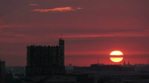 The sun sets below the horizon. High house. Tower. Industrial landscape. City Stock Footage 150099906