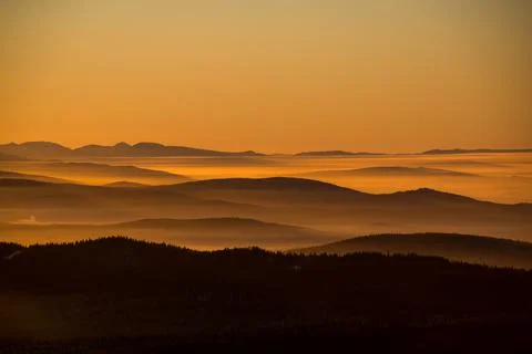 The sun sets below the horizon Stock Photos