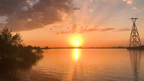 The sun sets below the horizon on the Volga River, Russia. Cable car. Stock Footage 154707681