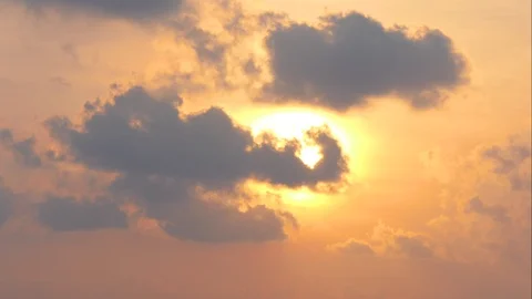 The sun sets with black clouds moving through.Time Lapse Stock-Footage 106696804