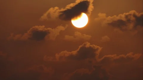 The sun sets with black clouds moving through.Time Lapse Stock-Footage 106741424