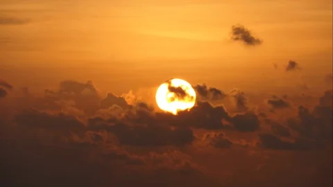 The sun sets with black clouds moving through.Time Lapse Stock-Footage 108306648