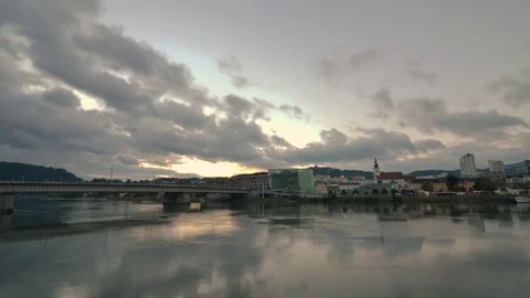 The sun sets on the Danube River in time lapse in Linz, Austria Stock Footage 70793219