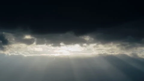 As the sun sets, the darkening sky is illuminated by the last rays of light. The Stock Footage 241310183
