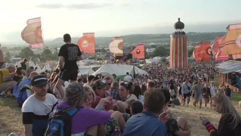 Sun sets on the first day of the Glastonbury festival Stock Footage
