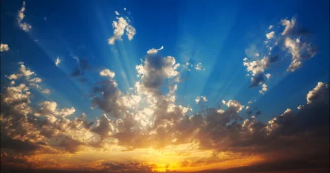 The sun sets, illuminating rays flying clouds Stock Footage 52923100