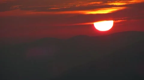 The sun sets on the mountains Stock Footage 68860179