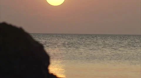 Sun Sets into the Ocean Video stock 12761592