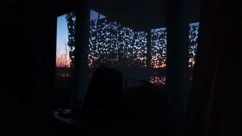 The sun sets outside the window Stock Footage 196822118