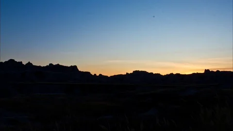 The sun sets over the Badlands Stock Footage 81762972
