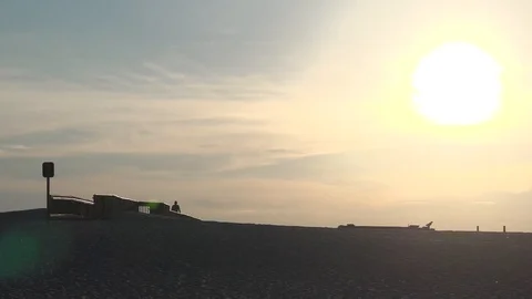 Sun sets over bridges to the beach Stock Footage 93593519