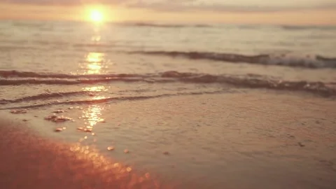 The sun sets over the horizon by the sea Stock Footage 159728308