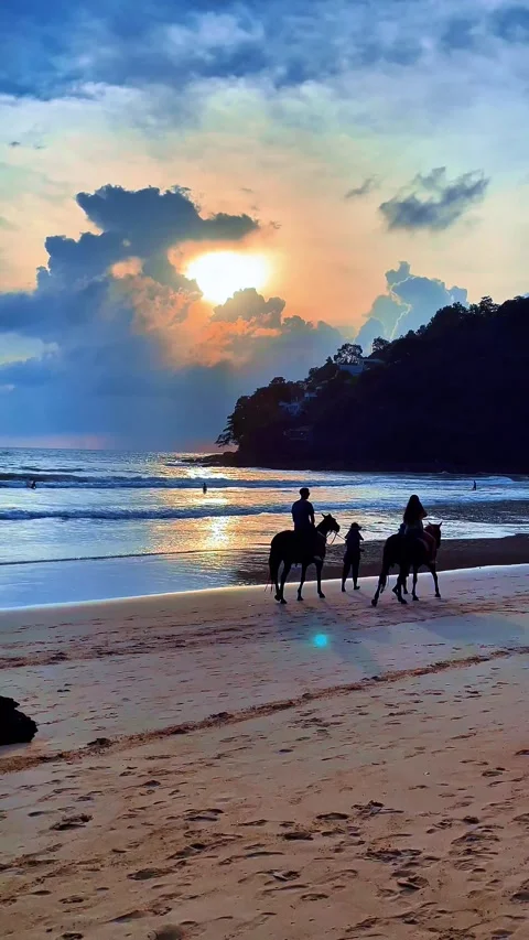 The sun sets over the ocean and the beach 스톡 동영상 312423190