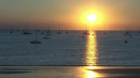 Sun sets over ocean Stock Footage 11344422