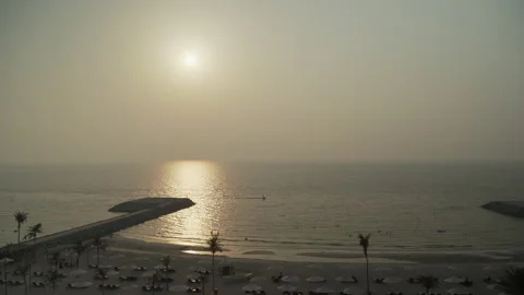 The sun sets over the ocean horizon Stock Footage 167737241