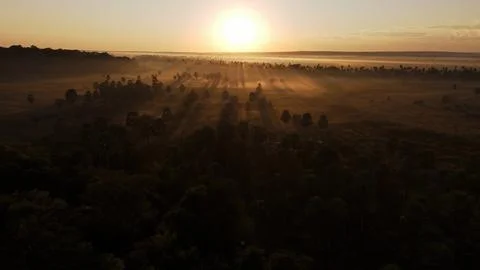 The sun sets over an open field Foto stock