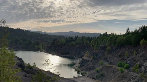 The sun sets on the rocky mountain side overlooking Shawnigan quarry. Stock Footage 132339487