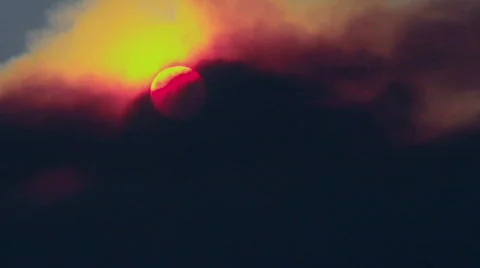 The sun sets through smoke from a forest fire. Stock Footage 555052