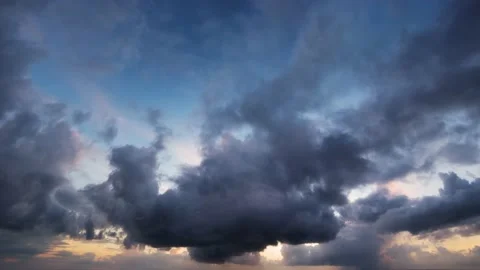 Sun Sets in Timelapse, Slowly Silhouetting Puffy Clouds into Darkness Stock Footage 140622197